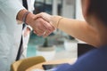 Two disciplines have partnered up. Closeup shot of doctors shaking hands during a meeting in a hospital. Royalty Free Stock Photo