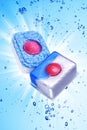 Two dishwasher detergent tablet under blue water