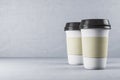 Two disposable white paper cup