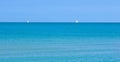 Two distant sailboats on a calm sea Royalty Free Stock Photo