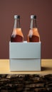 Two distinct nonalcoholic beverage bottles accompanied by a white paper box, isolated on a Toscha background