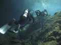 Two divers exploring the cenotes in Mexico - Underwater at cenote Chac Mool in the Riviera Maya, Mexico Royalty Free Stock Photo