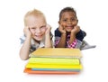 Two diverse little school children with their books