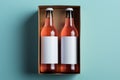 Two diverse nonalcoholic drink bottles with a white paper box on a Toscha background