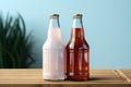 Two diverse nonalcoholic soda bottles with a white paper box on a Toscha background