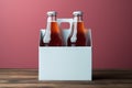 Two diverse nonalcoholic soda bottles with a white paper box on a Toscha background