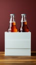 Two diverse nonalcoholic soda bottles with a white paper box on a Toscha background