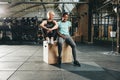 Fit young friends sitting together and smiling after a gym worko Royalty Free Stock Photo