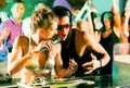 Two DJs in disco club, crowd background Royalty Free Stock Photo