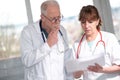 Two doctors discussing about medical report Royalty Free Stock Photo