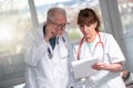 Two doctors discussing about medical report Royalty Free Stock Photo