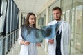 Two doctors examining lungs x-ray images of patient for diagnosis Royalty Free Stock Photo