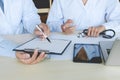 Two doctors have a discussion sitting at desk in the hospital Royalty Free Stock Photo