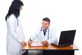 Two doctors having conversation in office Royalty Free Stock Photo