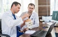 Two doctors having medical council in hospital. Discussing medical issues Royalty Free Stock Photo