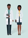 Two doctors male and female in uniform standing together. Man and woman doctors african characters