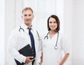 Two doctors with stethoscopes Royalty Free Stock Photo