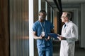 Two Doctors Talking in Hall Royalty Free Stock Photo