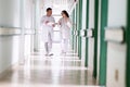 Doctors Walking in Hospital Hallway Royalty Free Stock Photo