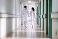Doctors Walking in Hospital Hallway Royalty Free Stock Photo