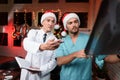 Two doctors work on New Year`s Eve and discuss an X-ray that is held in hands. Royalty Free Stock Photo