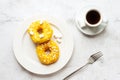 Two donuts with marshmallows and a cup of coffee Royalty Free Stock Photo