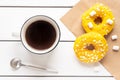 Two donuts with marshmallows and a cup of coffee Royalty Free Stock Photo