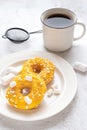 Two donuts with marshmallows and a cup of tea or coffee Royalty Free Stock Photo