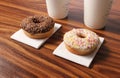 Two donuts on an office desk