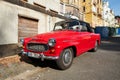 The two-door classic retro cabriolet Skoda Felicia equipped with a black folding roof hood. Front-side view. Royalty Free Stock Photo