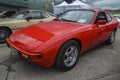 A two-door red sports car Porsche 924 1984 at the exhibition or retro cars in Kyiv