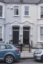 Two doors on a facade of terraced houses in West Hampstead, London