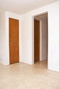 Two doors and an open doorway Royalty Free Stock Photo