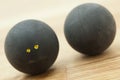 Two double yellow dot squash balls Royalty Free Stock Photo