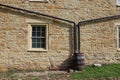 Two Downspouts and a Rain Barrel Royalty Free Stock Photo