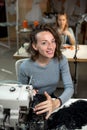 Two dressmakers work in the workshop on sewing machines Royalty Free Stock Photo