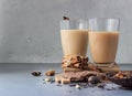 Two drinking glasses with traditional Indian drink - masala chai tea milk tea with spices for making tea. Royalty Free Stock Photo