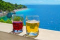 Two drinks with view of beach punta rata in croatia, brela