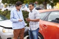 Two Drivers Exchange Insurance Details After Accident Royalty Free Stock Photo