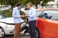 Two Drivers Exchange Insurance Details After Accident Royalty Free Stock Photo