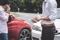 Two drivers man arguing after a car traffic accident collision and making phone call to Insurance Agent, Traffic Accident and Royalty Free Stock Photo