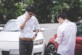 Two drivers man arguing after a car traffic accident collision and making phone call to Insurance Agent, Traffic Accident and Royalty Free Stock Photo