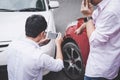 Two drivers man arguing after a car traffic accident collision and making phone call to Insurance Agent and take a photo, Traffic Royalty Free Stock Photo