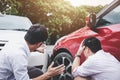 Two drivers man arguing after a car traffic accident collision,