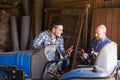 Two drivers working with tractor