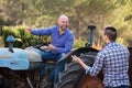 Two drivers working with tractor