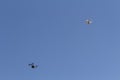 Two Drones Flying In Blue Sky With Cameras Royalty Free Stock Photo