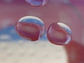Two drops of water on a colored surface Royalty Free Stock Photo