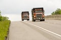 Two red dump trucks Royalty Free Stock Photo