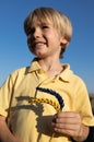 two ears of wheat painted in yellow blue colors of Ukrainian flag in hands of boy